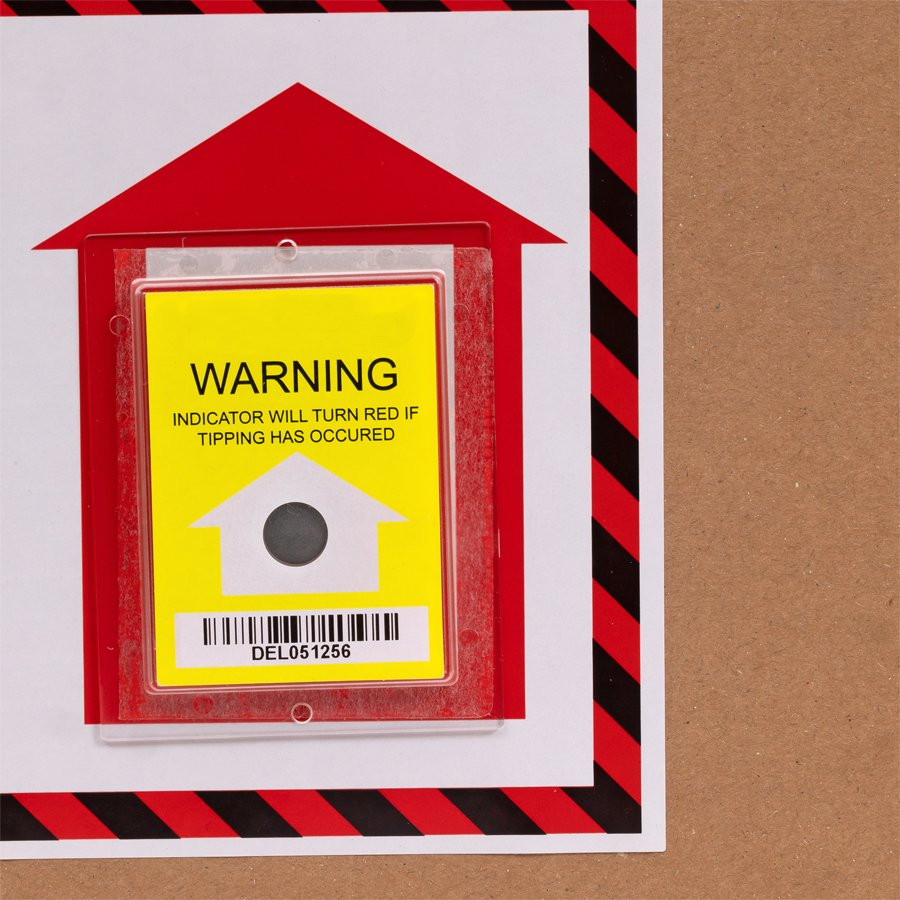 Kippindikator mit Warnhinweis Aufrecht positionieren. Nahaufnahme Kippindikator mit Warnhinweis